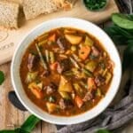 white bowl of Mulligan stew with brown bread