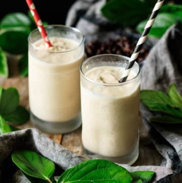 two glasses of Chick-fil-A frosted coffee with paper straws.