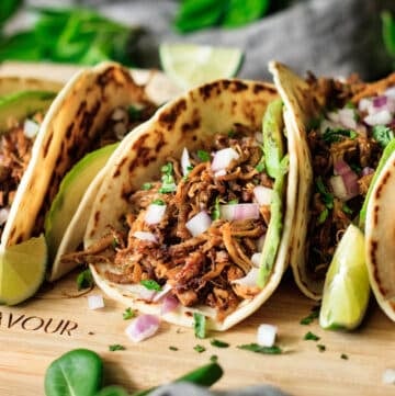 browned tortilla filled with Chipotle pork carnitas, red onion, and avocado.