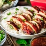 teriyaki chicken in a bowl of white rice.
