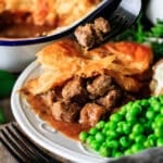 holding a forkful of Scottish steak pie.