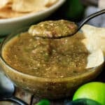holding a spoonful of Chipotle tomatillo-green chili salsa.