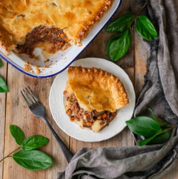 slice of corned beef pie on a plate with a fork.
