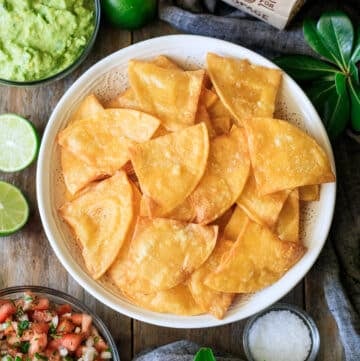 bowl of Chipotle tortilla chips with salsa and guac.