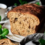 sliced Lincolnshire plum bread on a white platter.