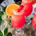 hurricane mocktail with an orange slice.