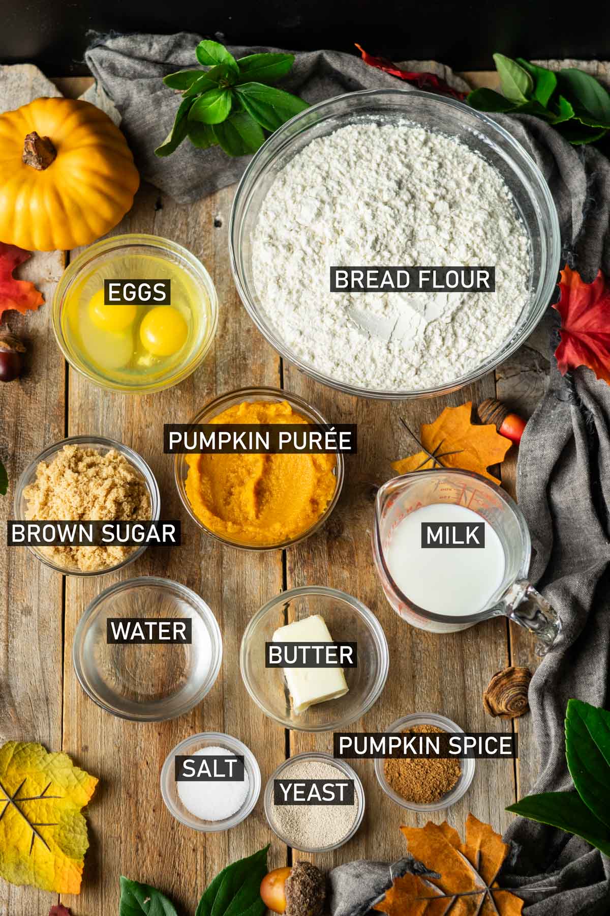 bowls of ingredients for pumpkin dinner rolls.
