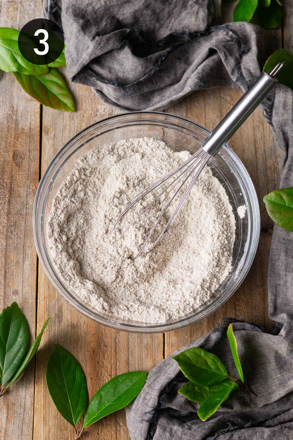whisked dry ingredients in a glass bowl.