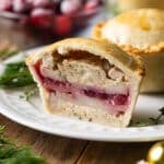 half of a turkey cranberry pie cut in half to show layers.