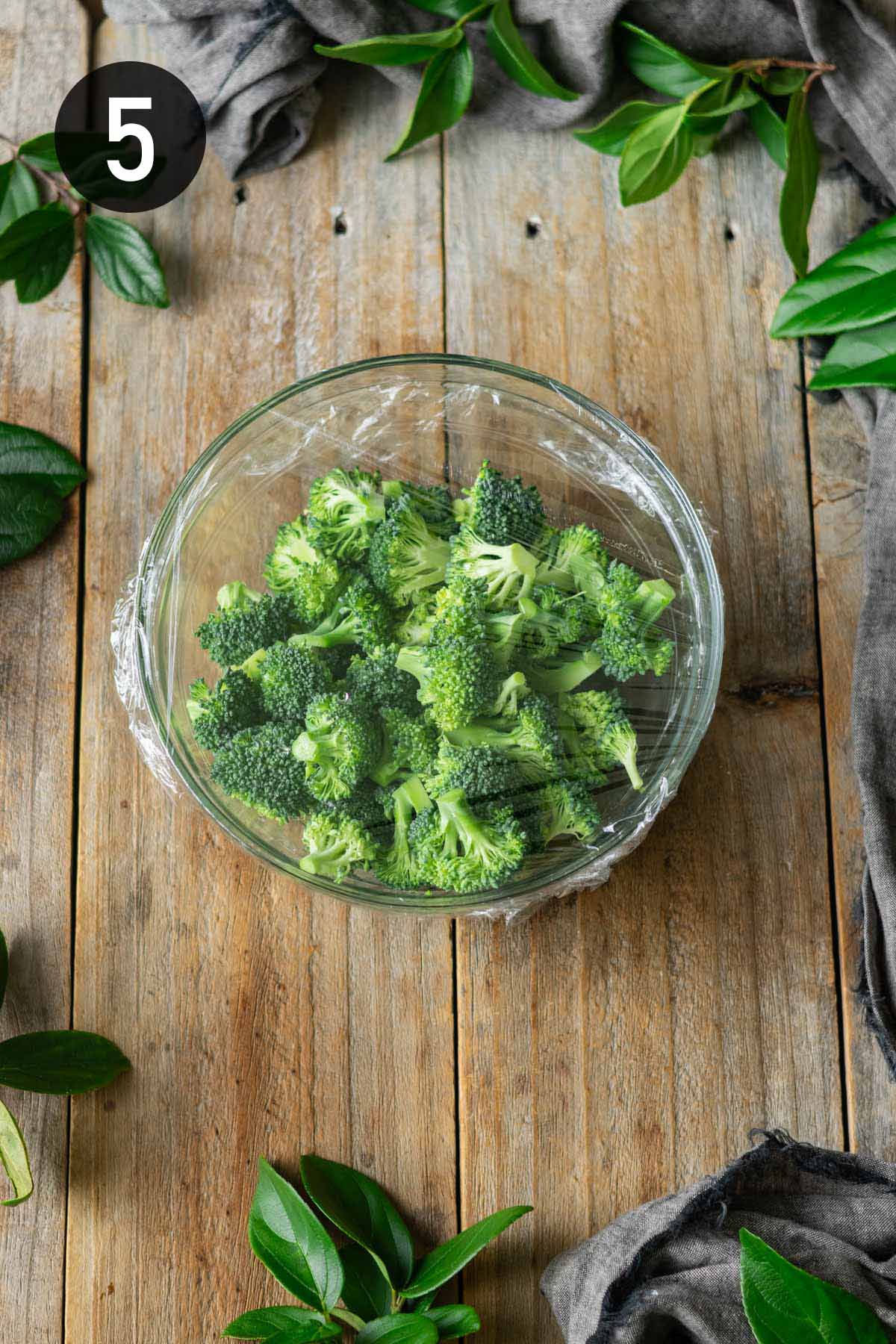 steaming the broccoli in a covered bowl in the microwave.