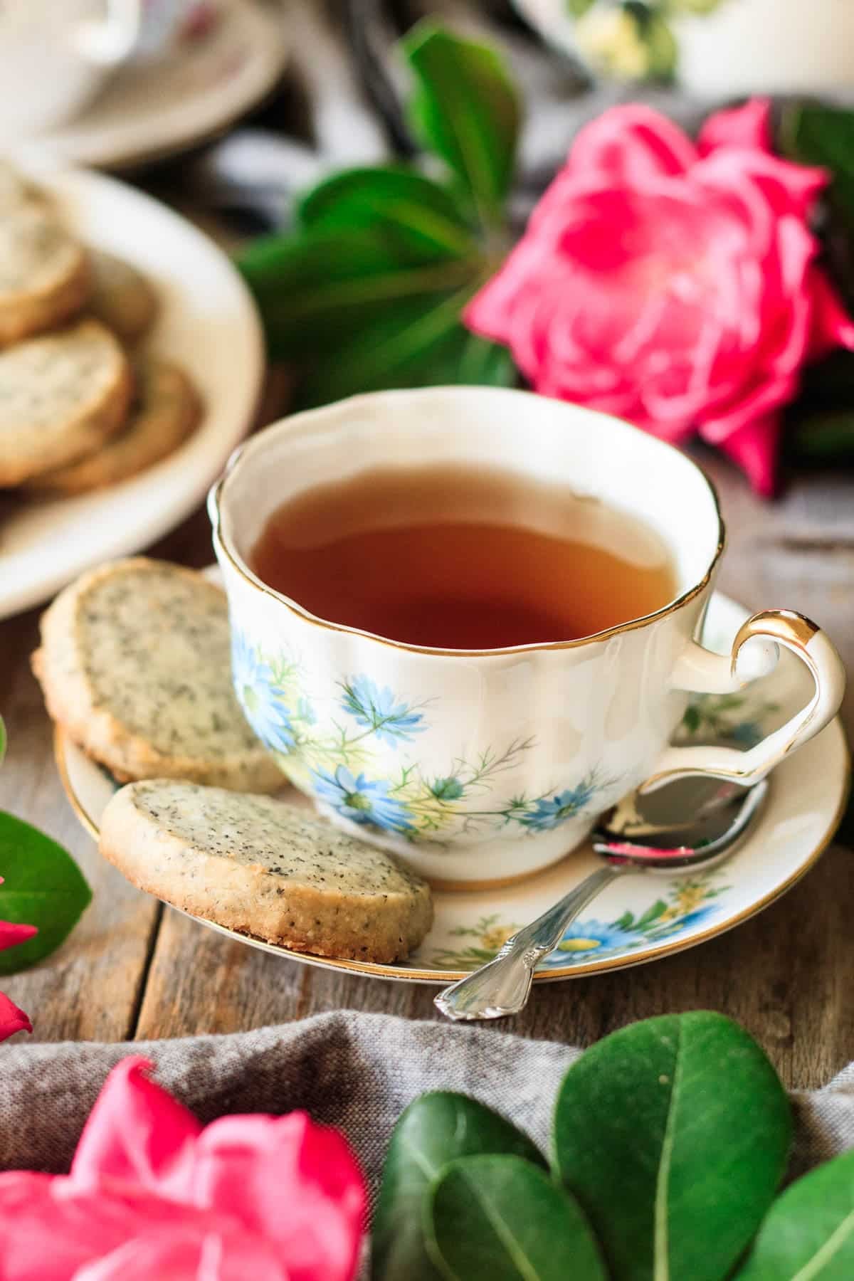 cup of tea with two Earl Grey shortbread cookies on the saucer.