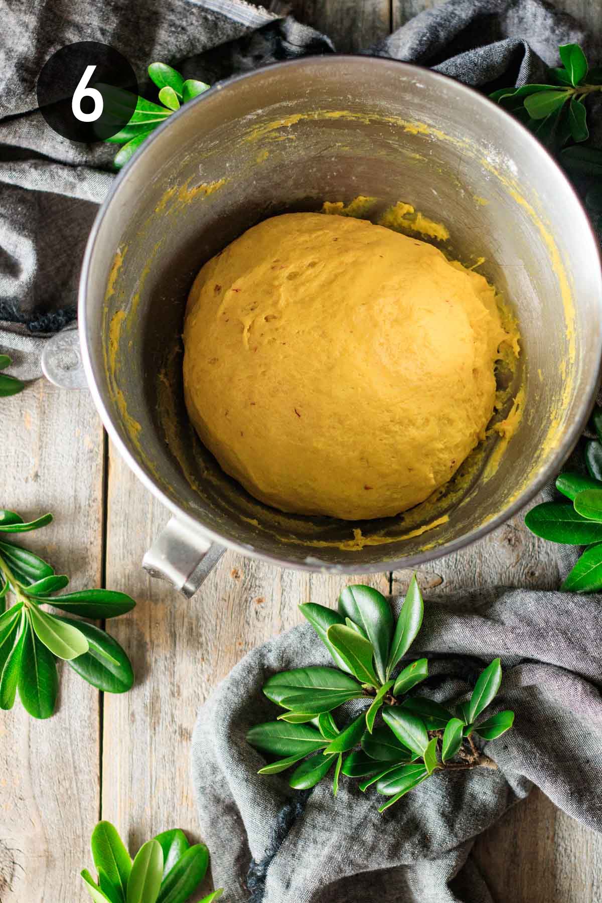 kneaded dough ready to rise in a mixing bowl.