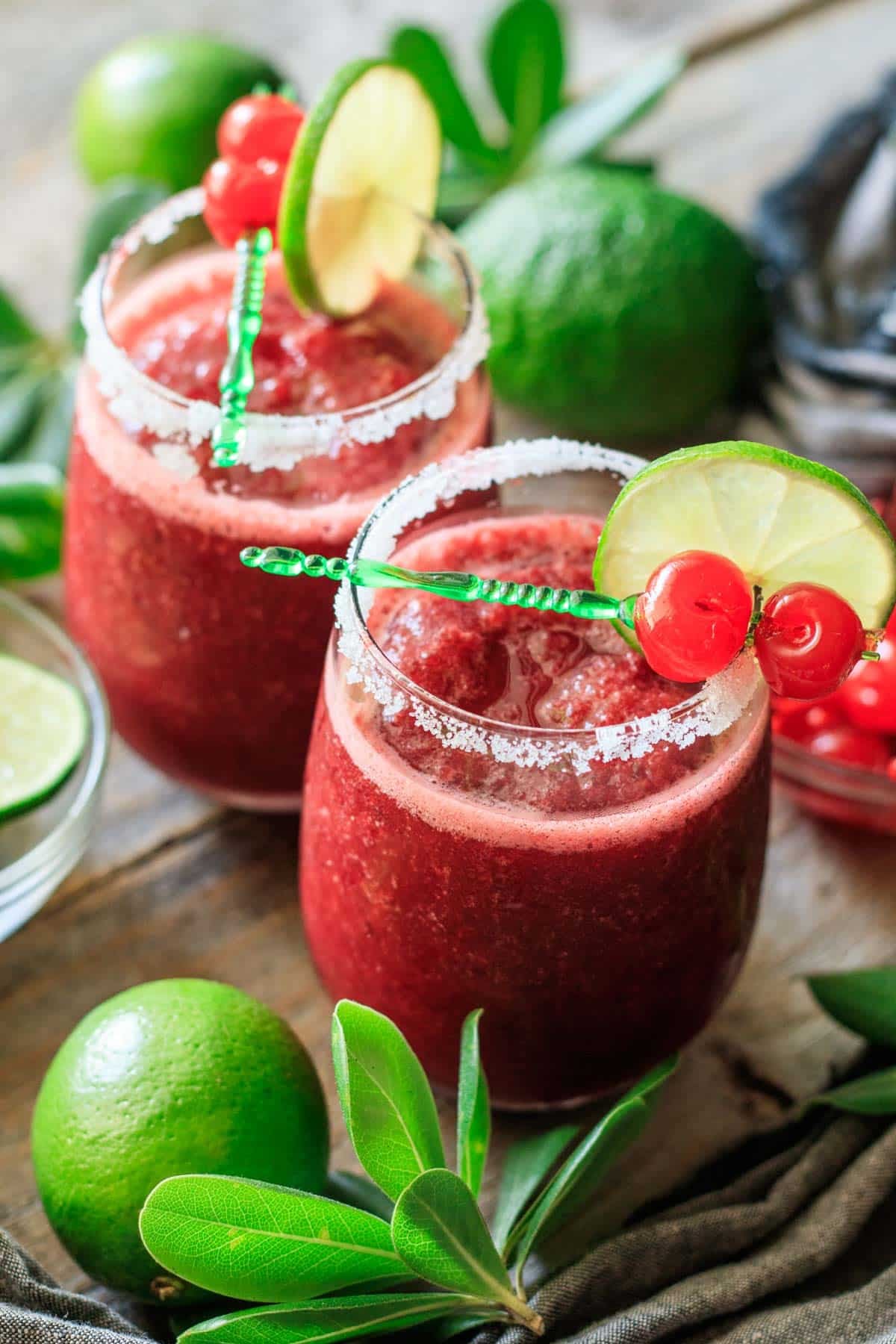 two stemless glasses of frozen cherry limeade.