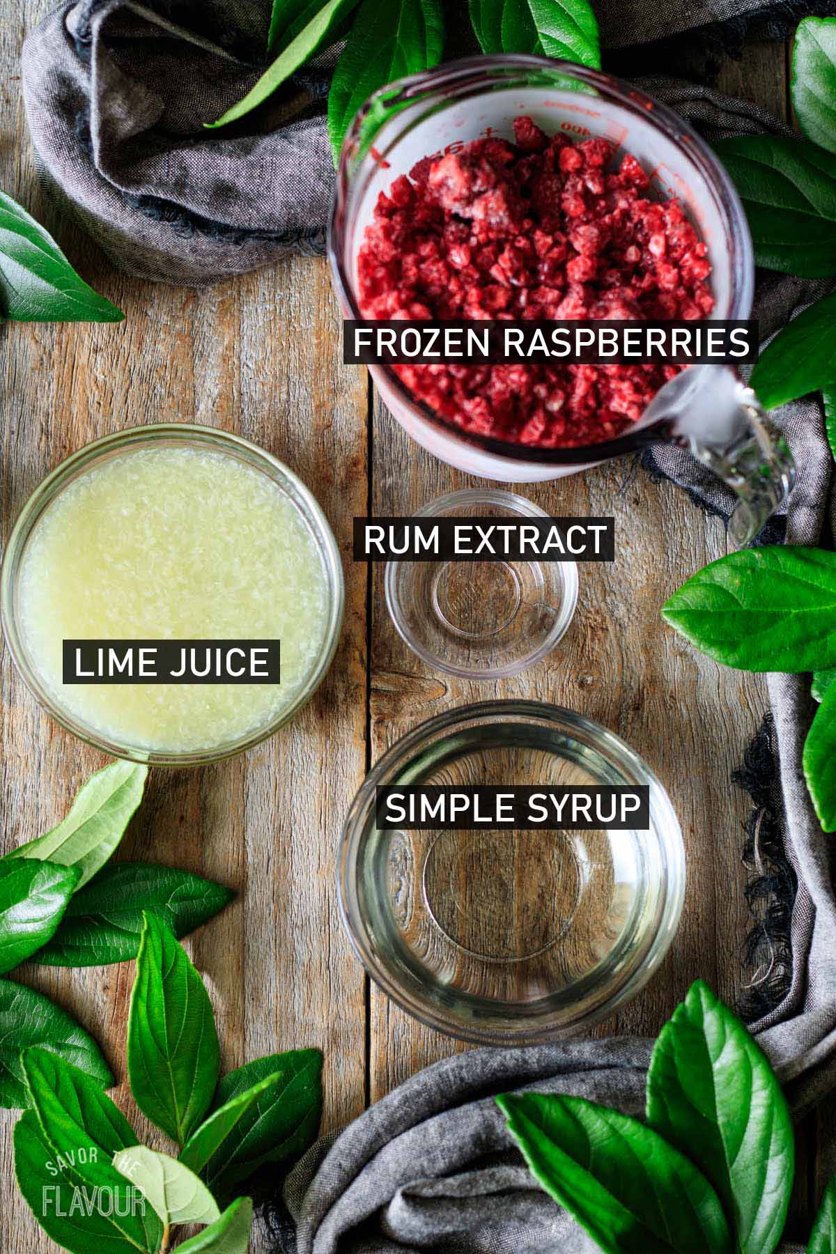 glass bowls of ingredients for virgin raspberry daiquiri.