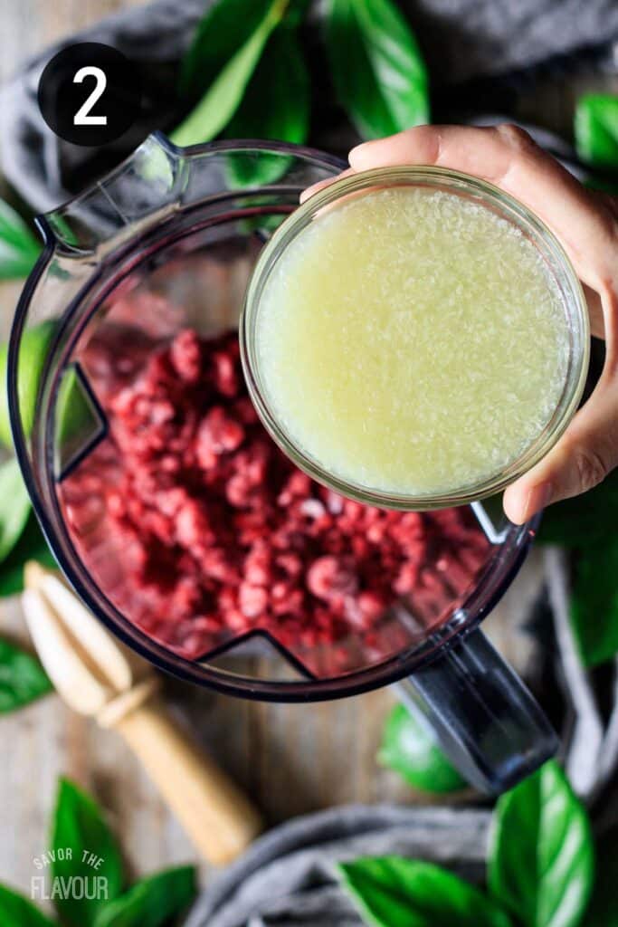 adding lime juice to frozen raspberries.