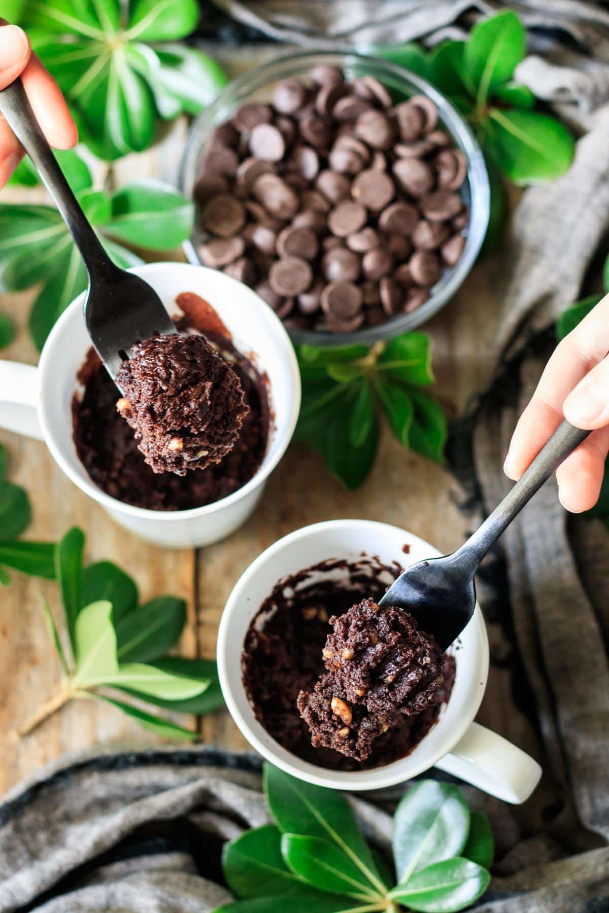 people holding forkfuls of vegan mug brownie.