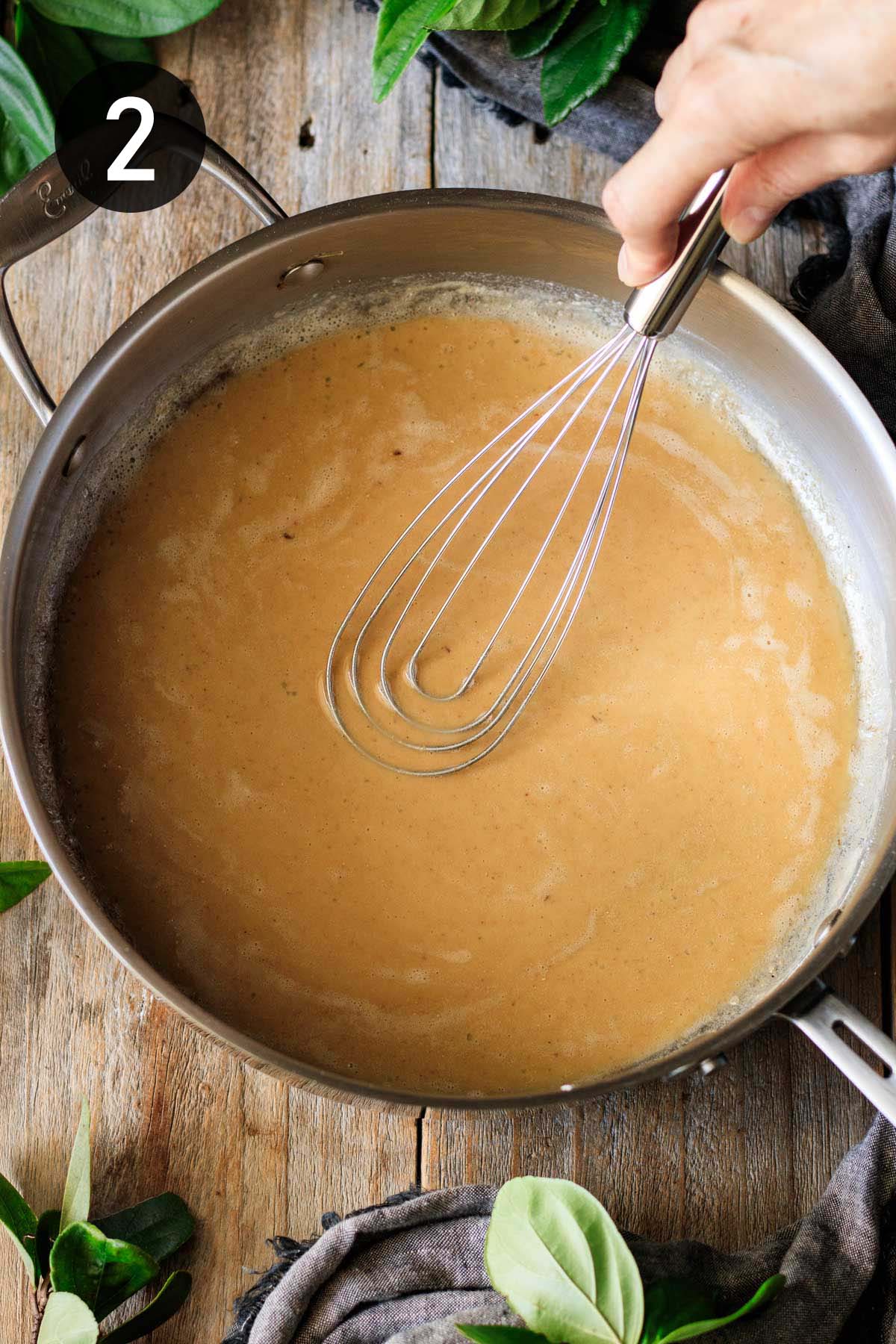 whisking flour and butter roux until golden.